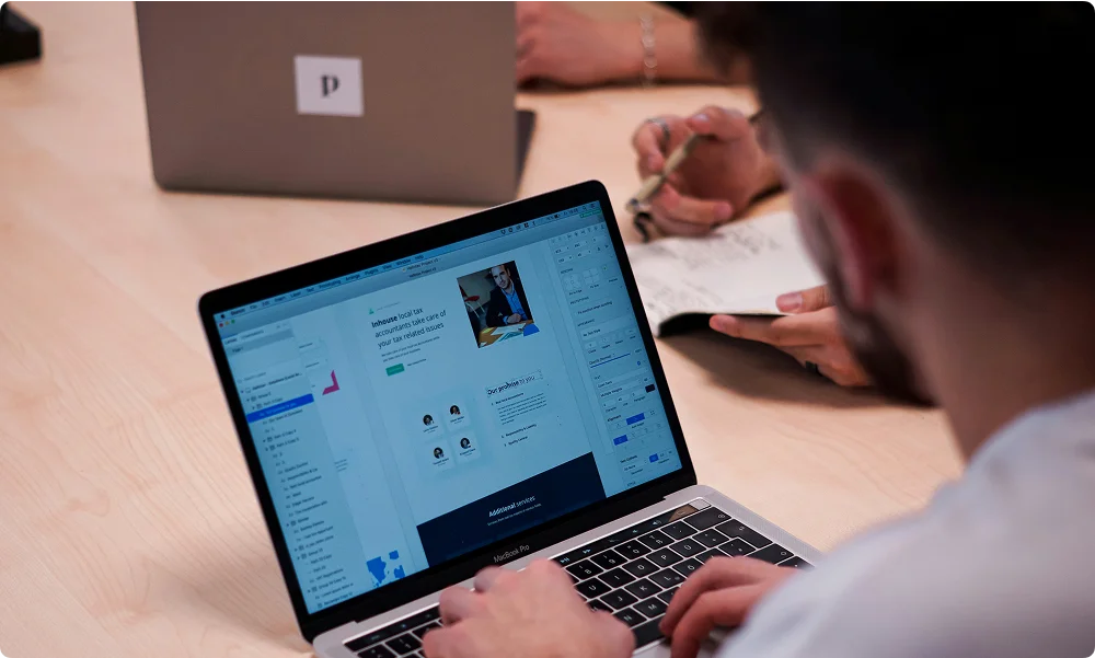 A person doing some designing using his laptop