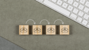 Lead nurturing email sequence represented by email icons on wooden cubes